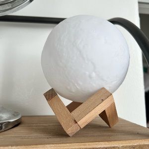 White plastic globes on wooden holder